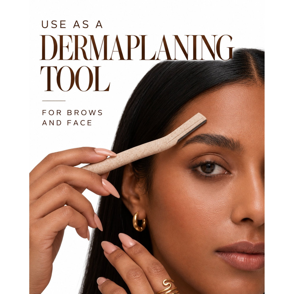 Woman using the dermaplaning tool on her brow to shape hairs and remove peach fuzz from the face.