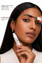 Close-up of a woman applying Brow Gel for a flexible hold that keeps brows in place and sets naturally all day.