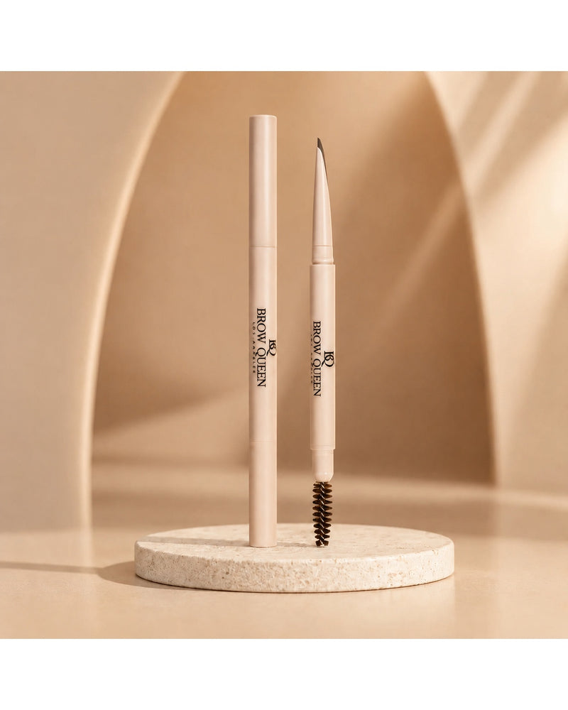 Dual-ended Eyebrow Pencil on a textured pedestal, showing the precision tip and spoolie brush for shaping and filling brows.